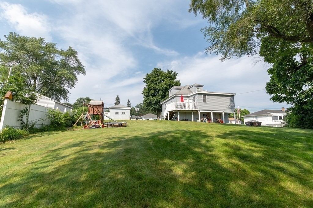 97 Bay State Road Methuen, MA 01844 - Photo 25 of 26 a front view of a house with a garden