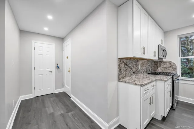 a bathroom with a granite countertop sink and a granite counter tops