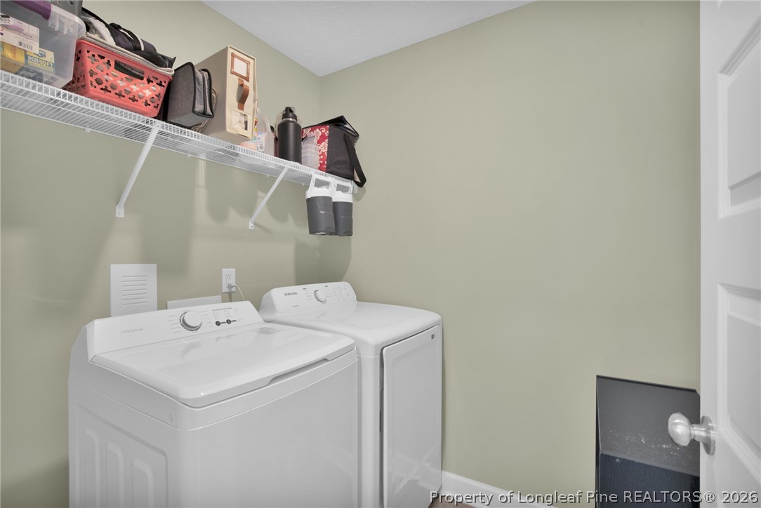 351 Sandy Grove Road Parkton, NC 28371 - Photo 23 of 30 a utility room with dryer and washer