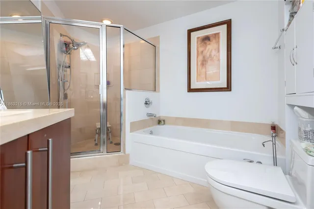 a bedroom with a bed a desk and chair