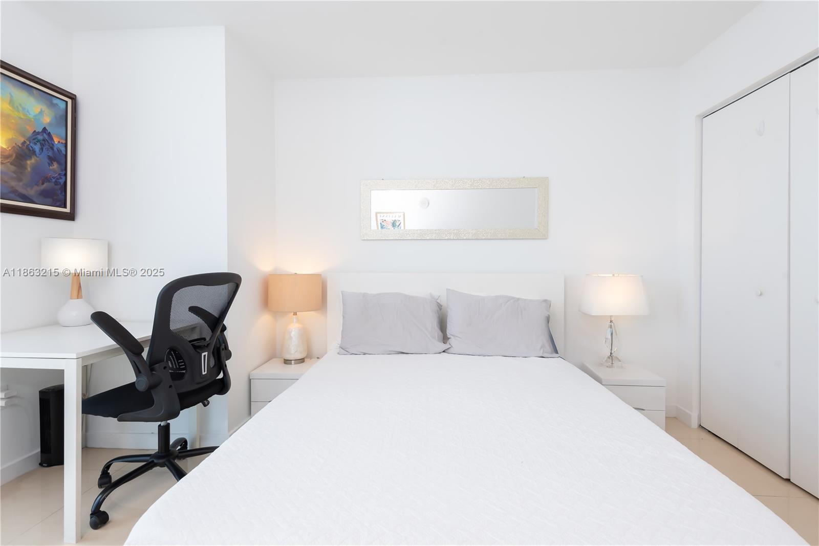 1111 Southwest 1st Avenue, Unit 3125N Miami, FL 33130 - Photo 22 of 49 a bedroom with a bed a desk and chair