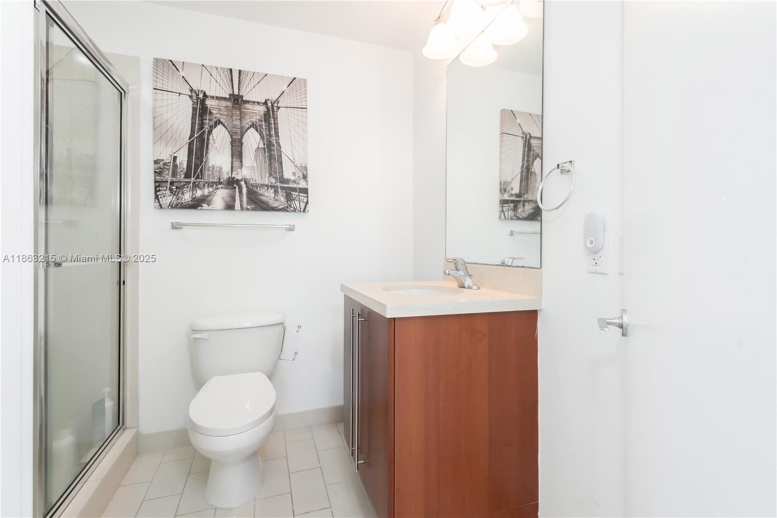 1111 Southwest 1st Avenue, Unit 3125N Miami, FL 33130 - Photo 25 of 49 a bathroom with a toilet sink and mirror