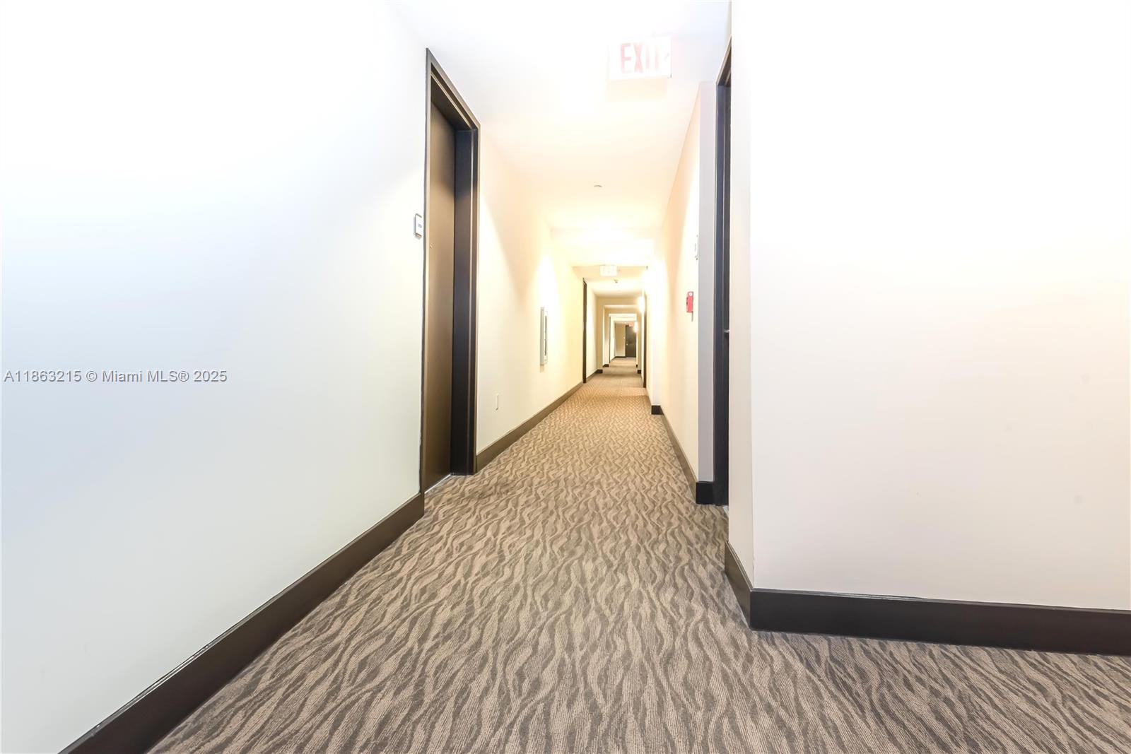 1111 Southwest 1st Avenue, Unit 3125N Miami, FL 33130 - Photo 3 of 49 a view of a hallway with wooden floor