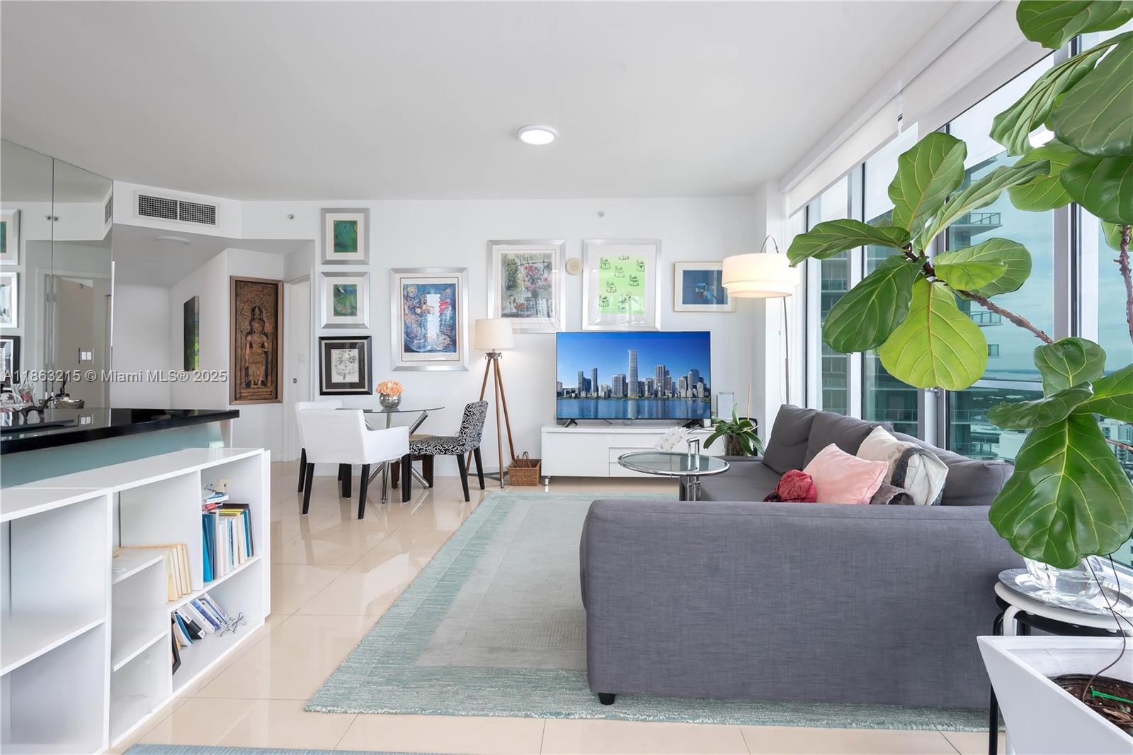 1111 Southwest 1st Avenue, Unit 3125N Miami, FL 33130 - Photo 5 of 49 a living room with furniture a fireplace and a potted plant