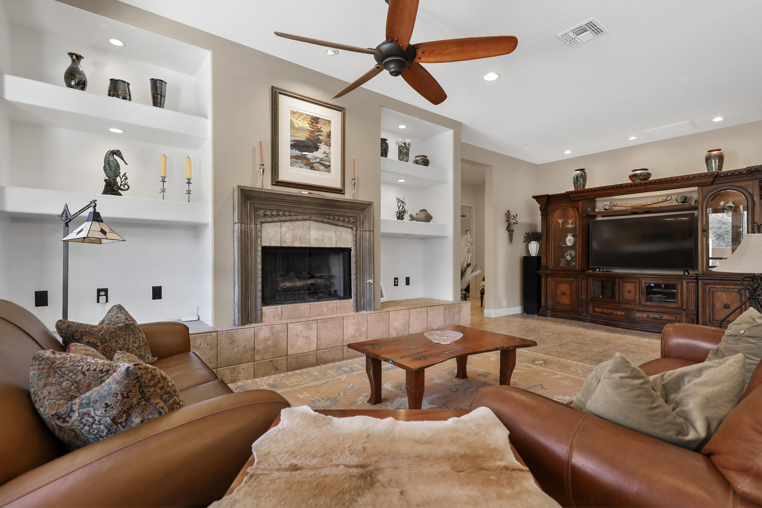 54855 Avenida Madero La Quinta, CA 92253 - Photo 11 of 48 a living room with furniture and a flat screen tv
