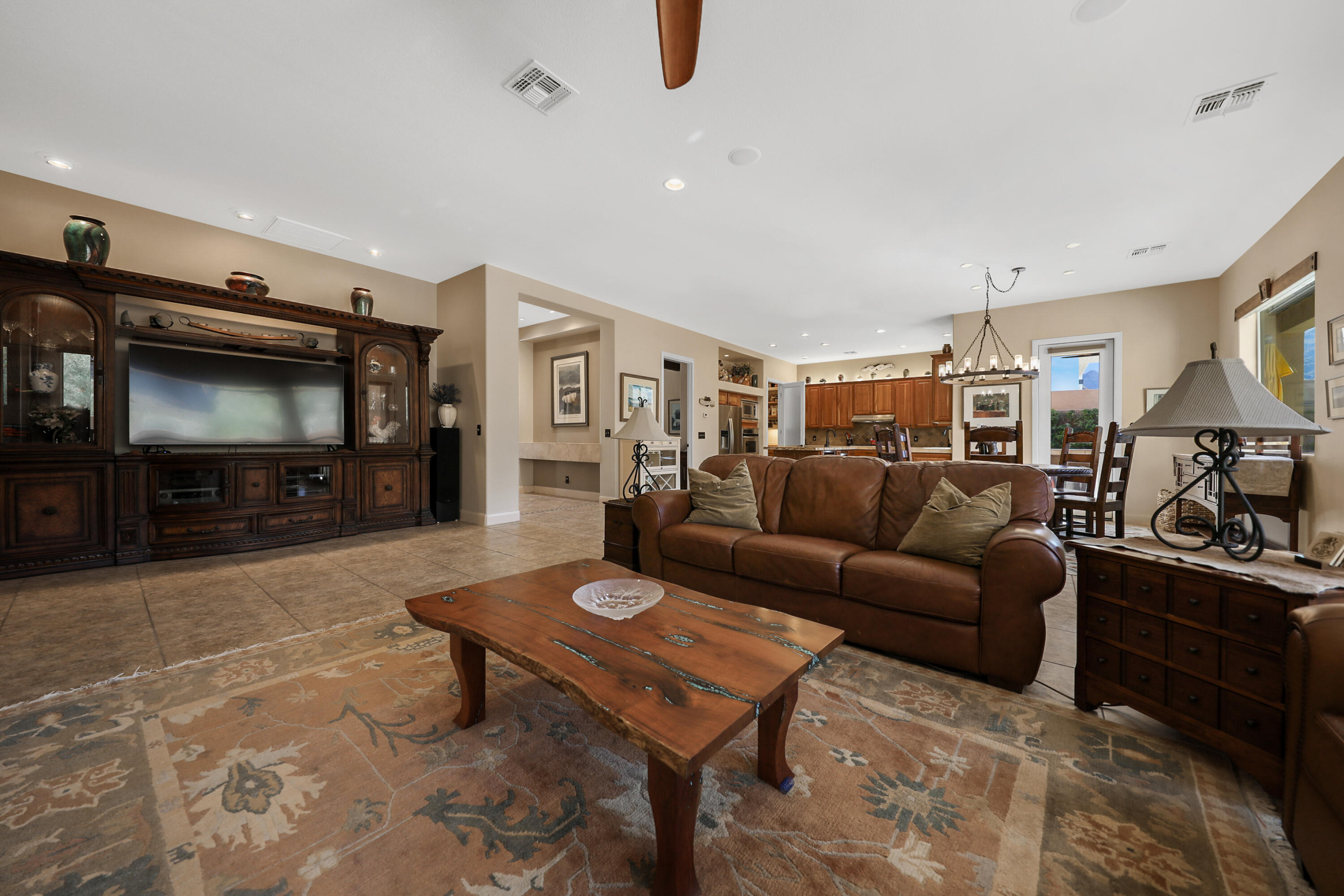 54855 Avenida Madero La Quinta, CA 92253 - Photo 12 of 48 a living room with furniture and a flat screen tv