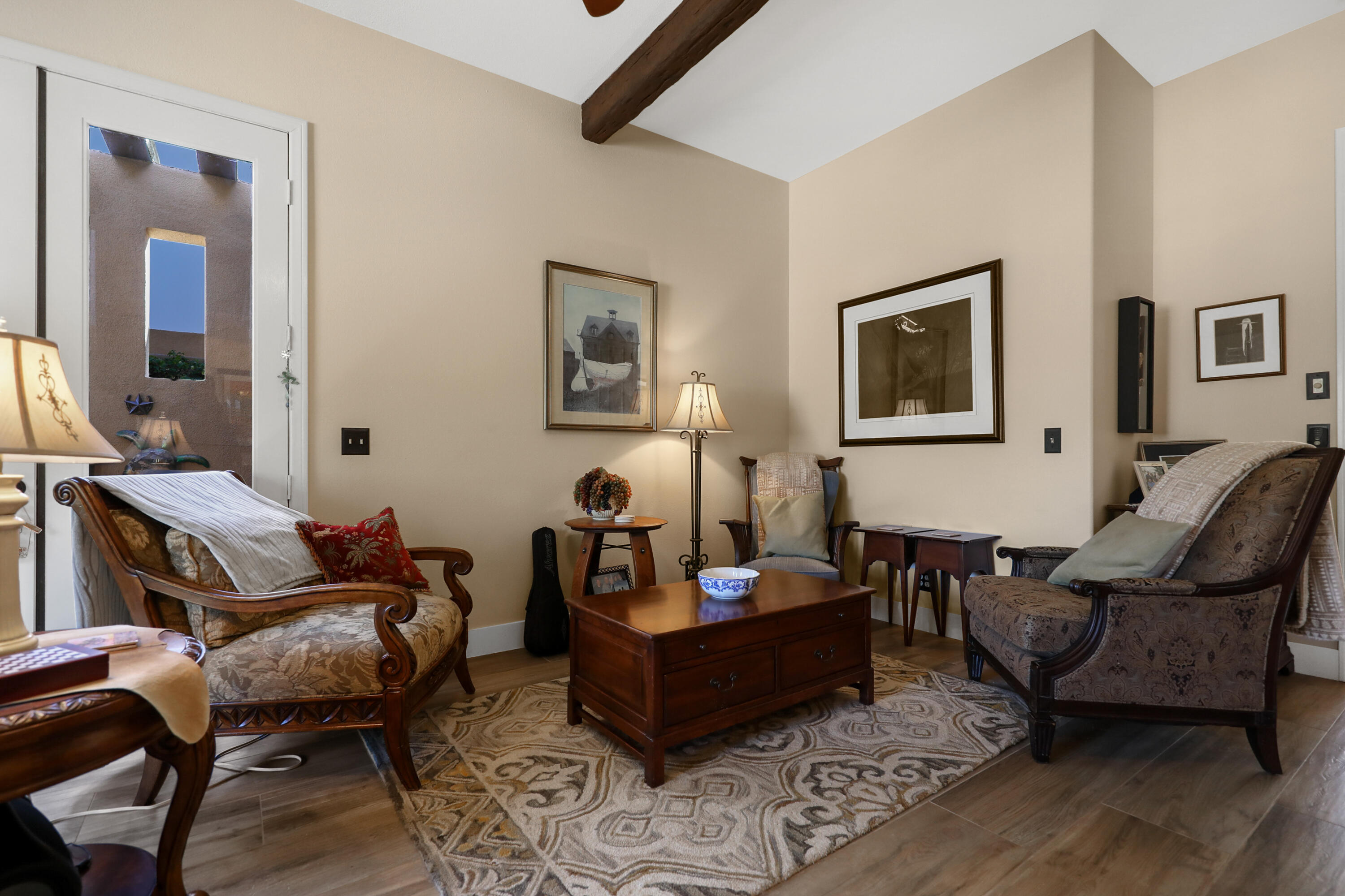 54855 Avenida Madero La Quinta, CA 92253 - Photo 19 of 48 a living room with furniture and wooden floor