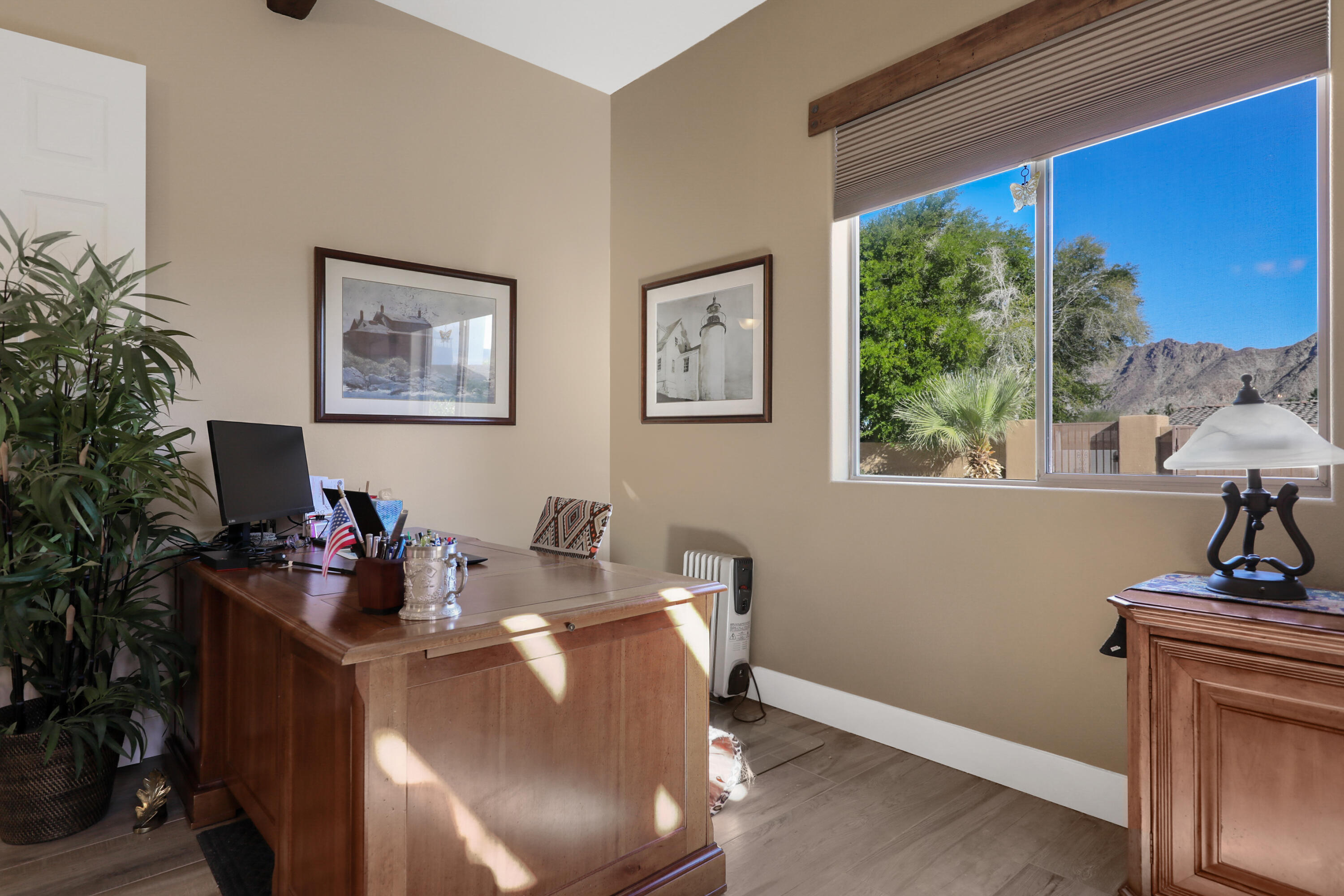 54855 Avenida Madero La Quinta, CA 92253 - Photo 20 of 48 a living room with furniture and a potted plant
