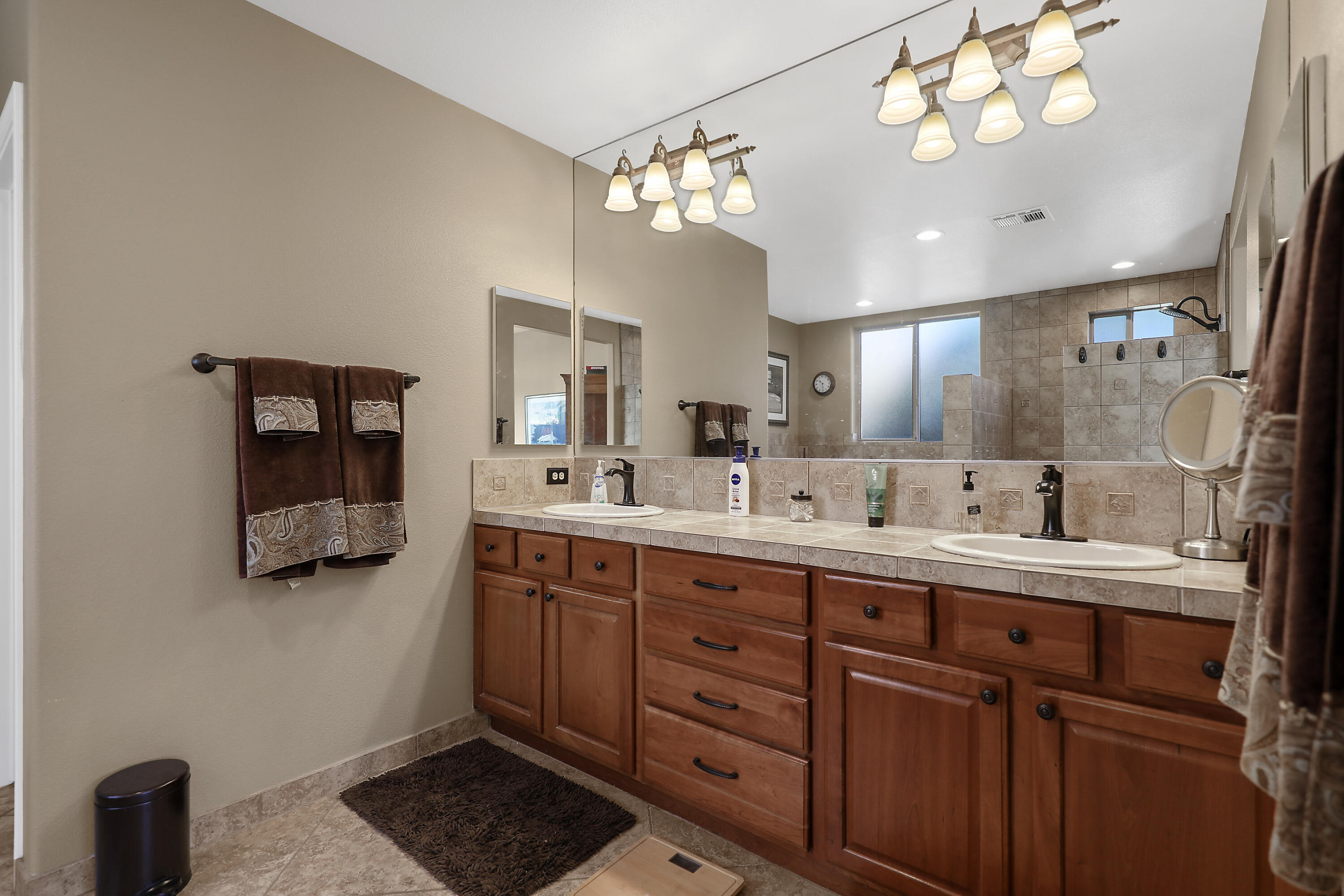 54855 Avenida Madero La Quinta, CA 92253 - Photo 24 of 48 a bathroom with a double vanity sink and a mirror