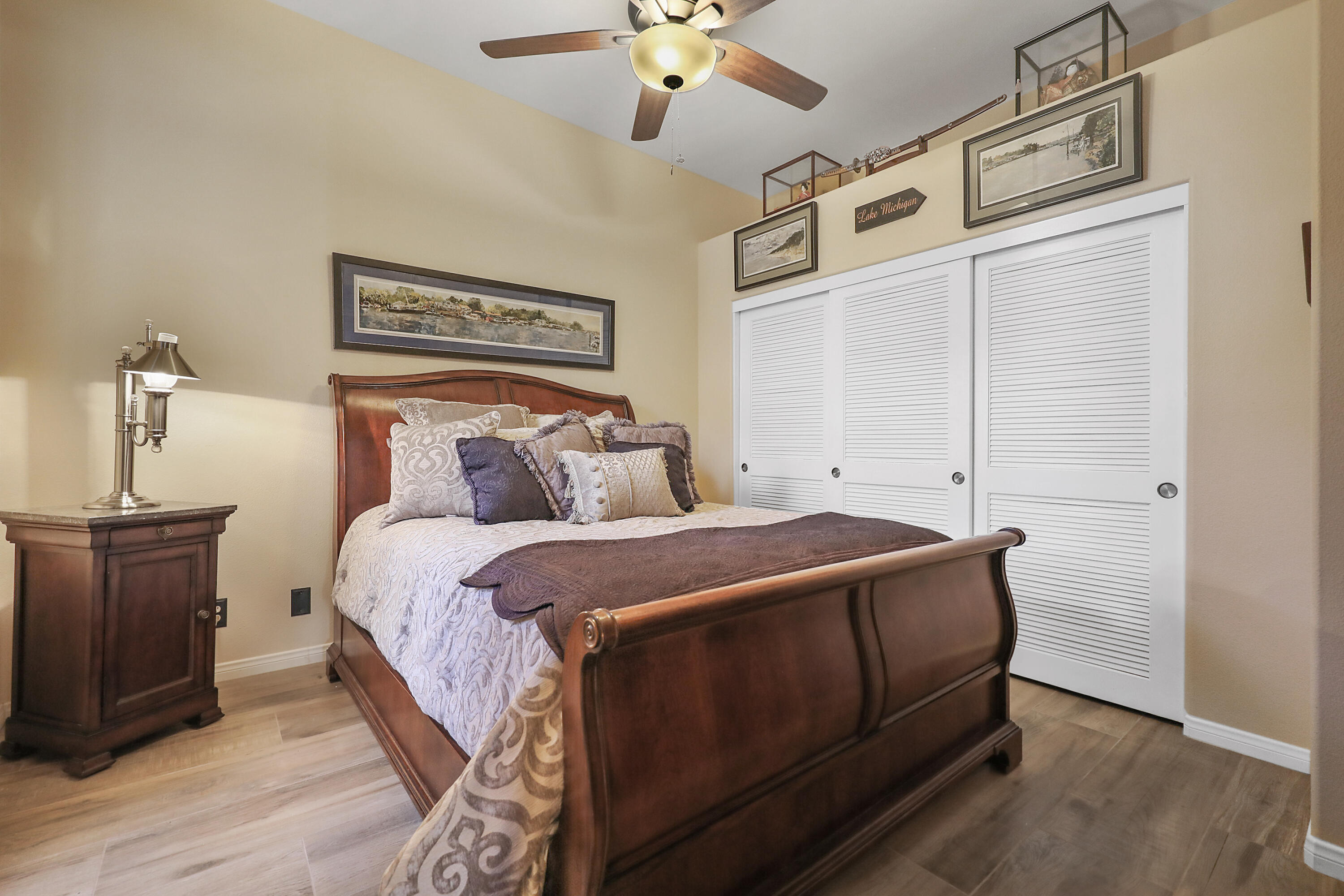 54855 Avenida Madero La Quinta, CA 92253 - Photo 30 of 48 a bedroom with a bed and a chandelier