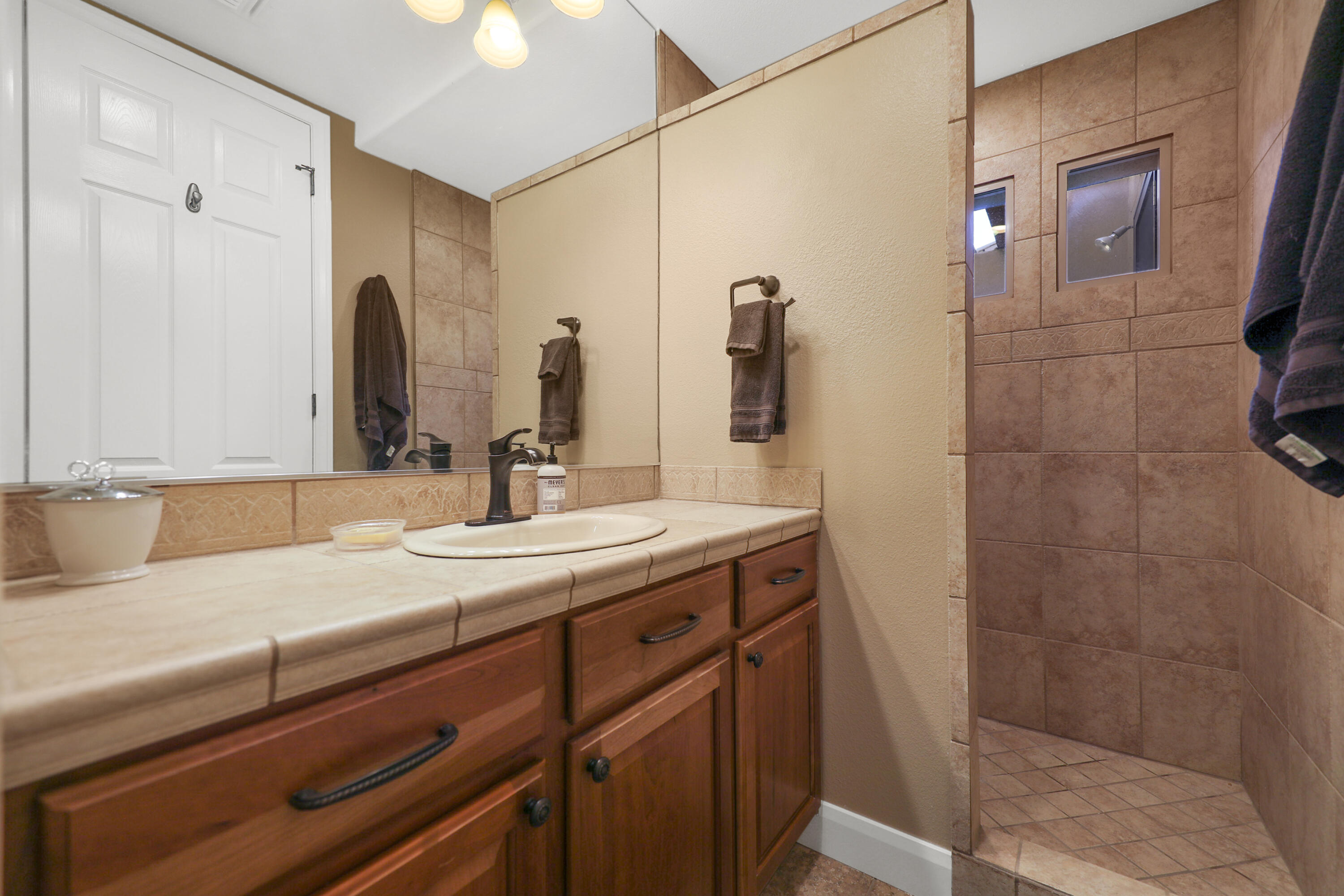 54855 Avenida Madero La Quinta, CA 92253 - Photo 31 of 48 a bathroom with a sink and a mirror