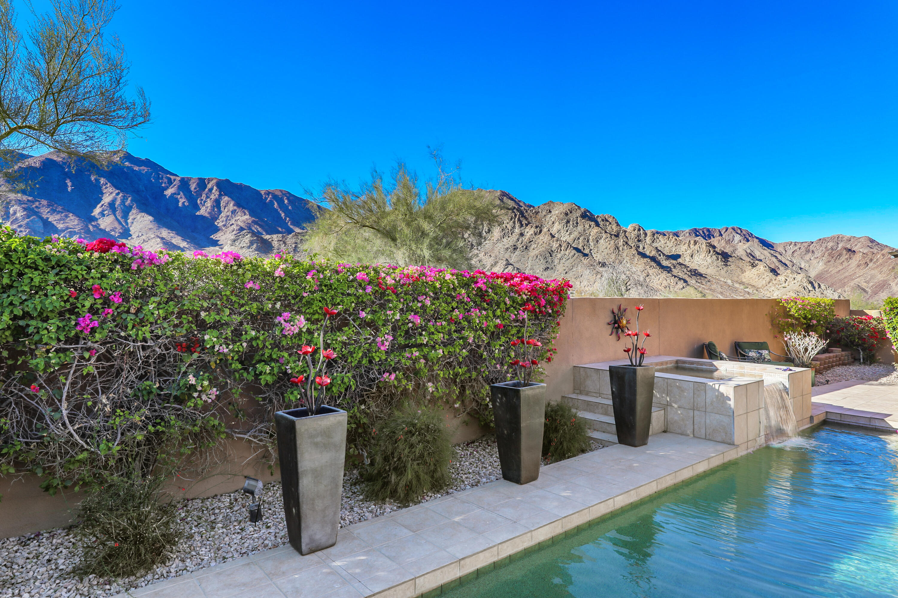 54855 Avenida Madero La Quinta, CA 92253 - Photo 38 of 48 a view of a house with a backyard and a garden