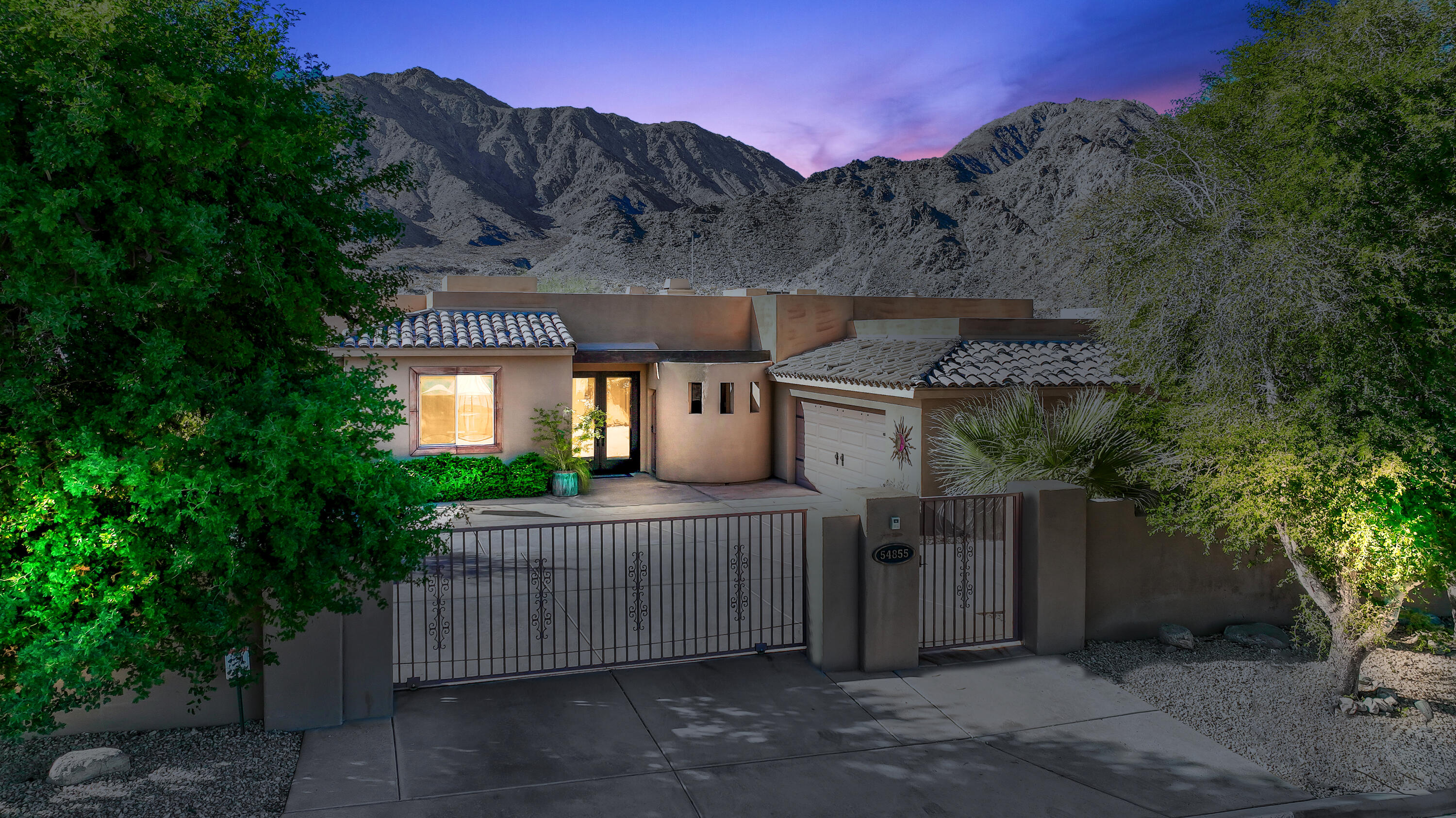 54855 Avenida Madero La Quinta, CA 92253 - Photo 4 of 48 a view of a house with mountain view and a garden