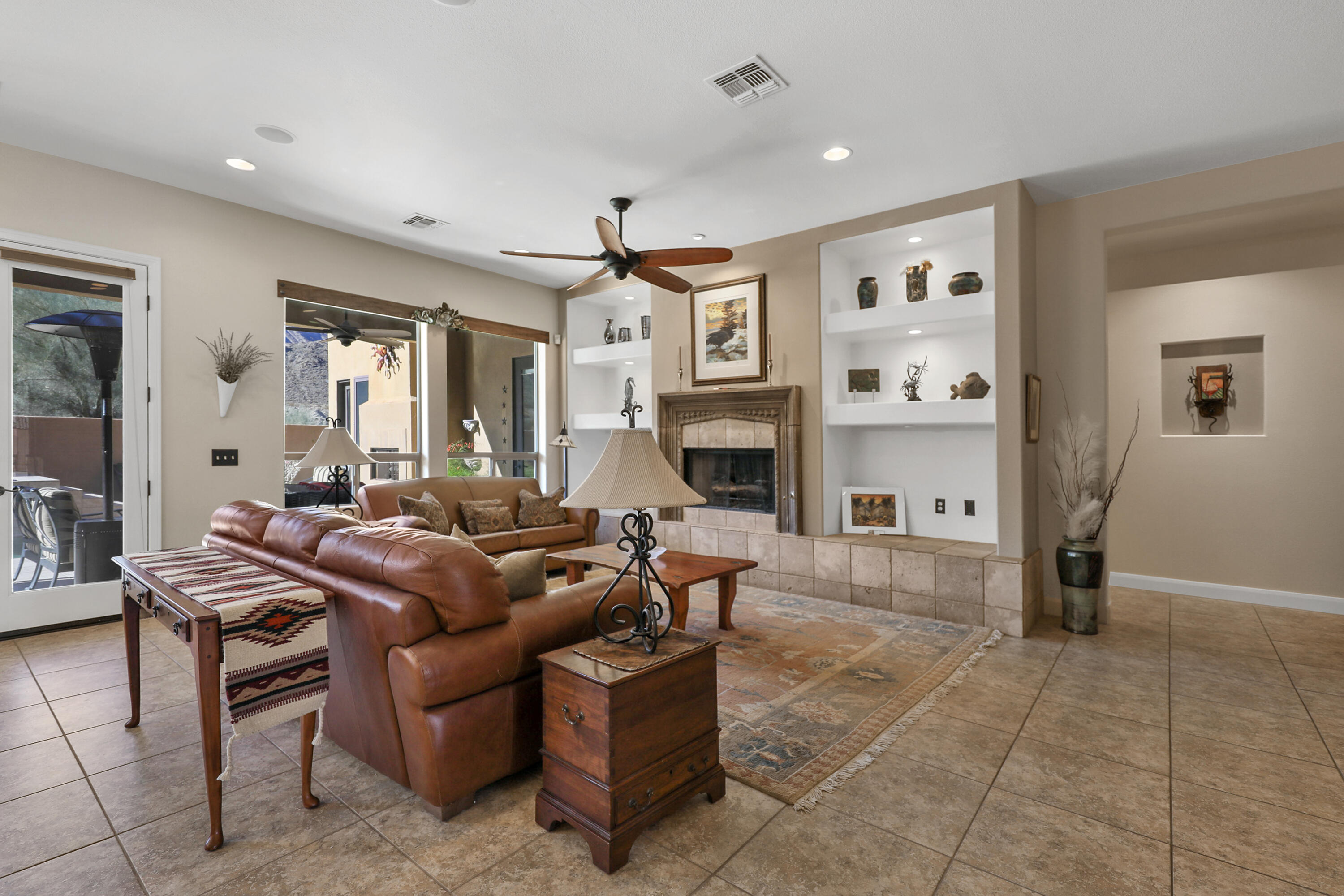 54855 Avenida Madero La Quinta, CA 92253 - Photo 10 of 48 a living room with furniture and a fireplace