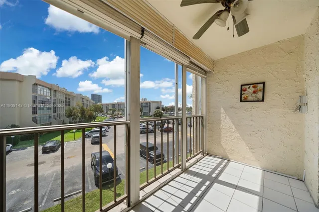 a view of a balcony with wooden floor