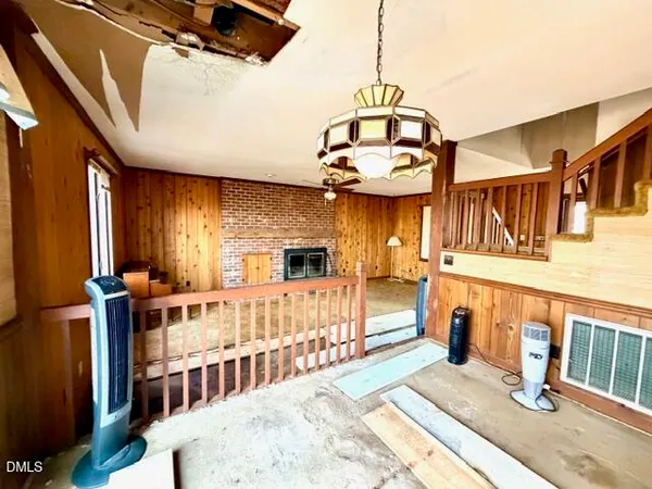 a kitchen with stainless steel appliances kitchen island granite countertop a refrigerator and a sink