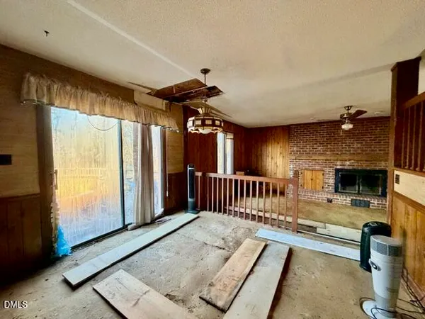 a kitchen with stainless steel appliances granite countertop a refrigerator a stove and a sink with cabinets
