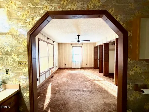 a view of a room with stuff and entryway