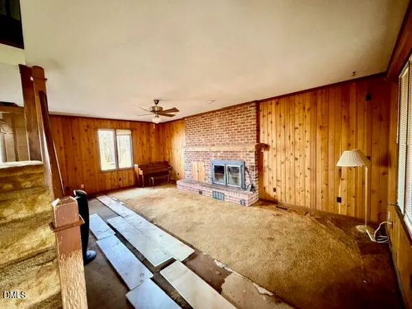 a spacious bedroom with a bed and a fireplace