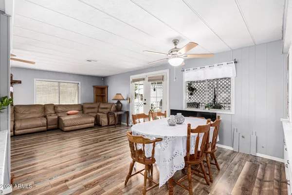 a view of a dining room with furniture window and wooden floor