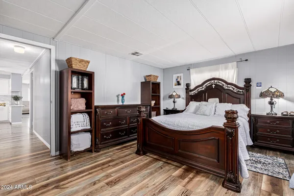 a bedroom with a bed and a dresser