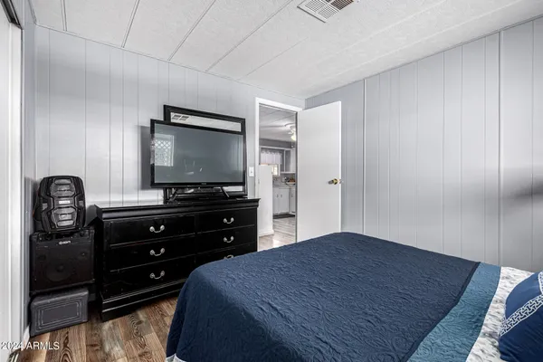a bathroom with a sink toilet a mirror and shower