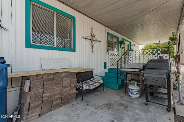 a room with lots of wooden furniture and a window