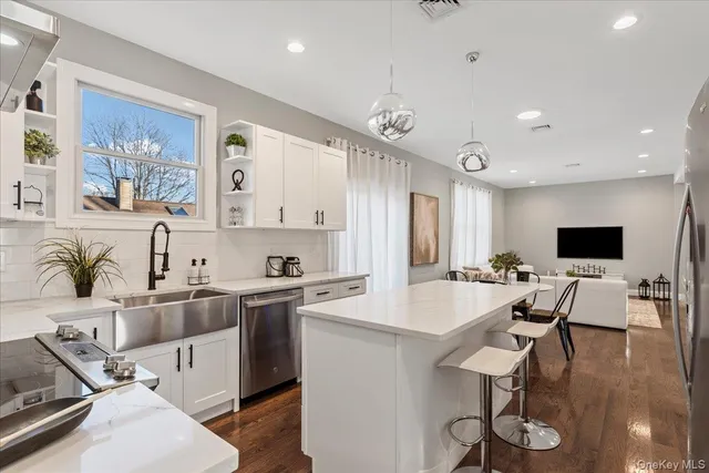 a large kitchen with a table and chairs