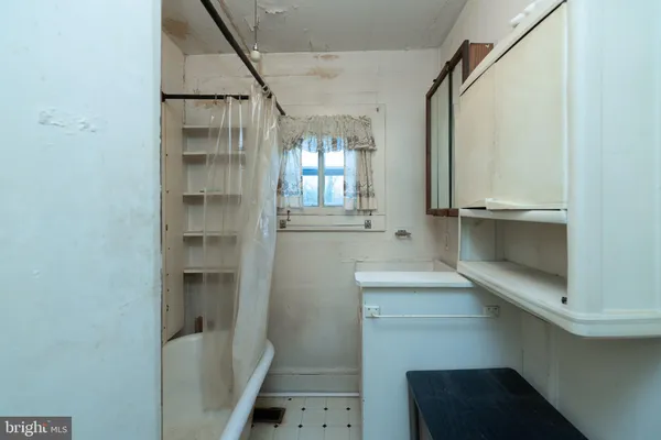 a bathroom with a sink and mirror