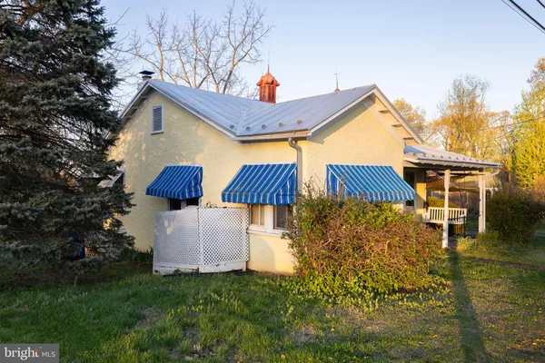 a front view of house with garden