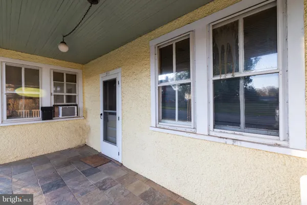 a view of a porch with wooden floor and a porch