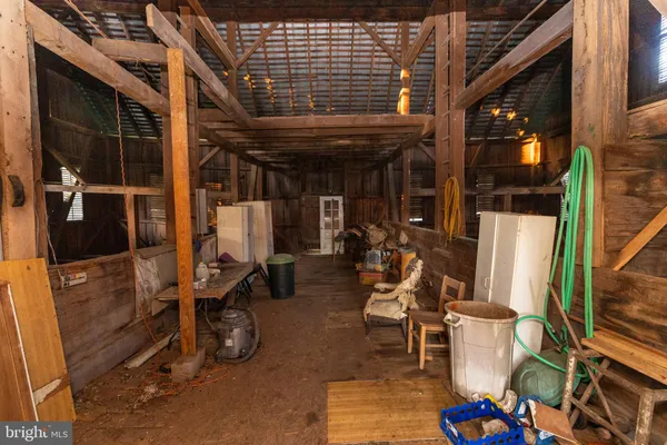 a view of a house with a small yard and wooden fence
