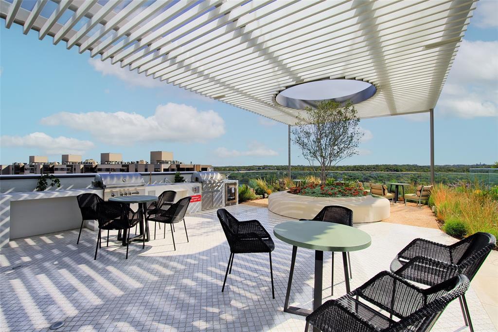 44 East Avenue, Unit 3109 Austin, TX 78701 - Photo 30 of 37 View of patio featuring a view of city, outdoor dining area, a pergola, and grilling area