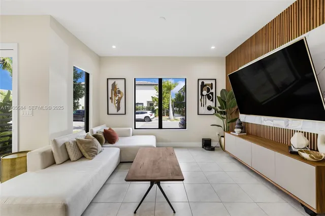a living room with furniture and a large window