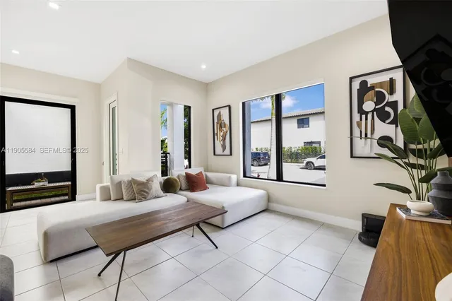 a view of an entryway with wooden floor