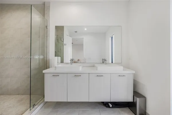 a view of a house with swimming pool and porch with furniture