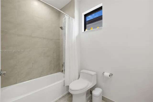 a bathroom with a double vanity sink and mirror