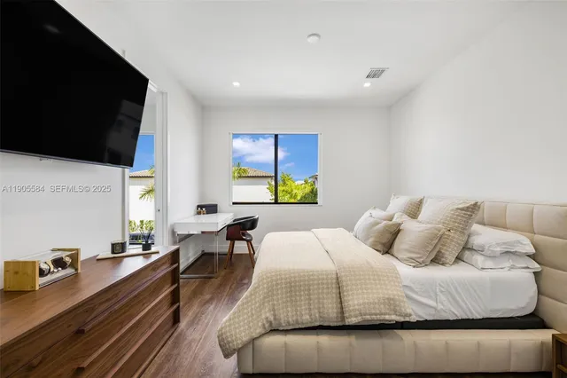 a bathroom with a double vanity sink toilet and shower