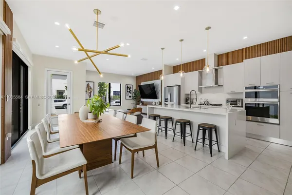 a view of kitchen with cabinets and stainless steel appliances