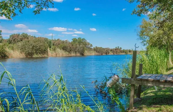 a view of a lake with a yard