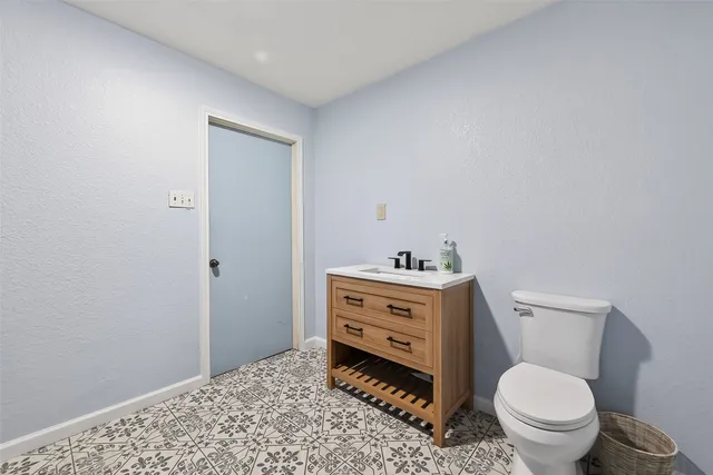 a bathroom with a toilet and a sink