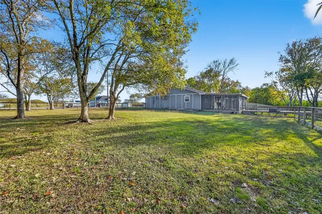 a view of a park with large trees