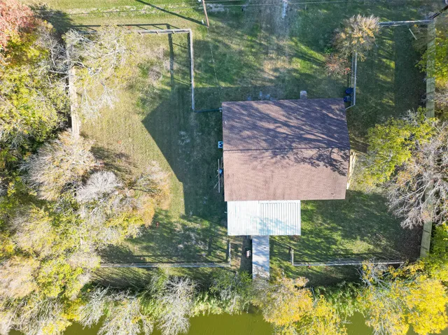a aerial view of a house with a lake view