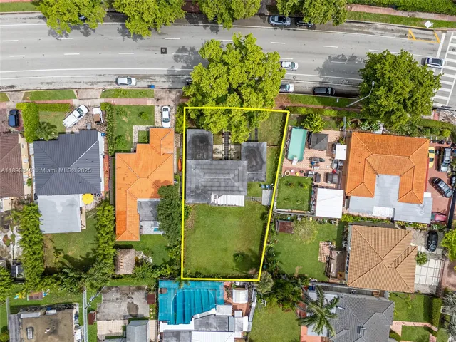 an aerial view of houses with outdoor space