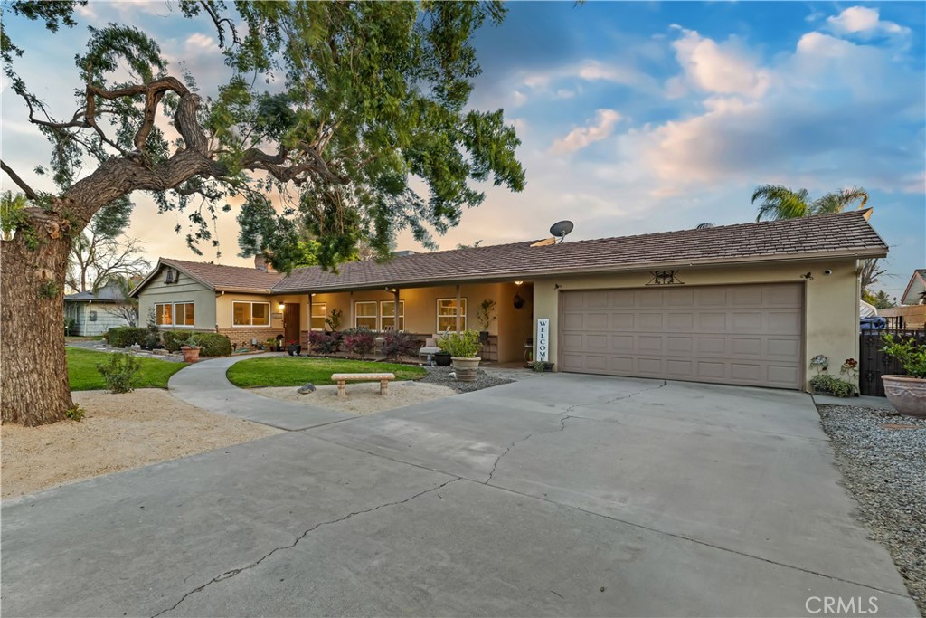 5496 Jurupa Avenue Riverside, CA 92504 - Photo 1 of 1 a view of a house with a yard and large tree