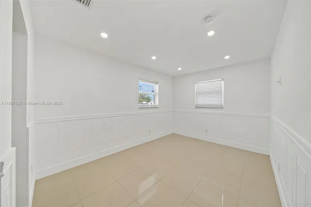 an empty room with a empty space and window