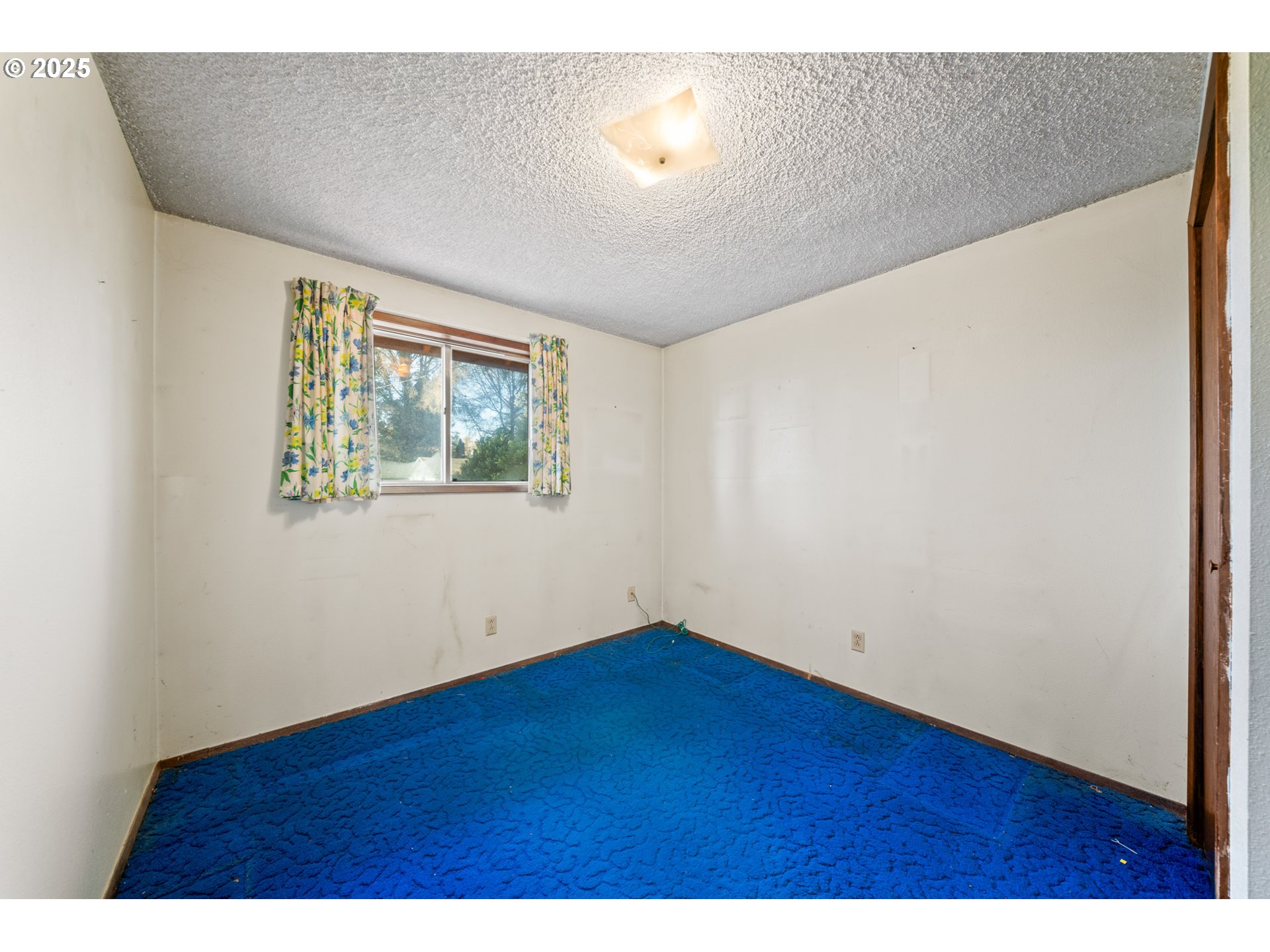 1109 Southeast 2nd Avenue Battle Ground, WA 98604 - Photo 15 of 30 a view of an empty room with wooden floor and a window