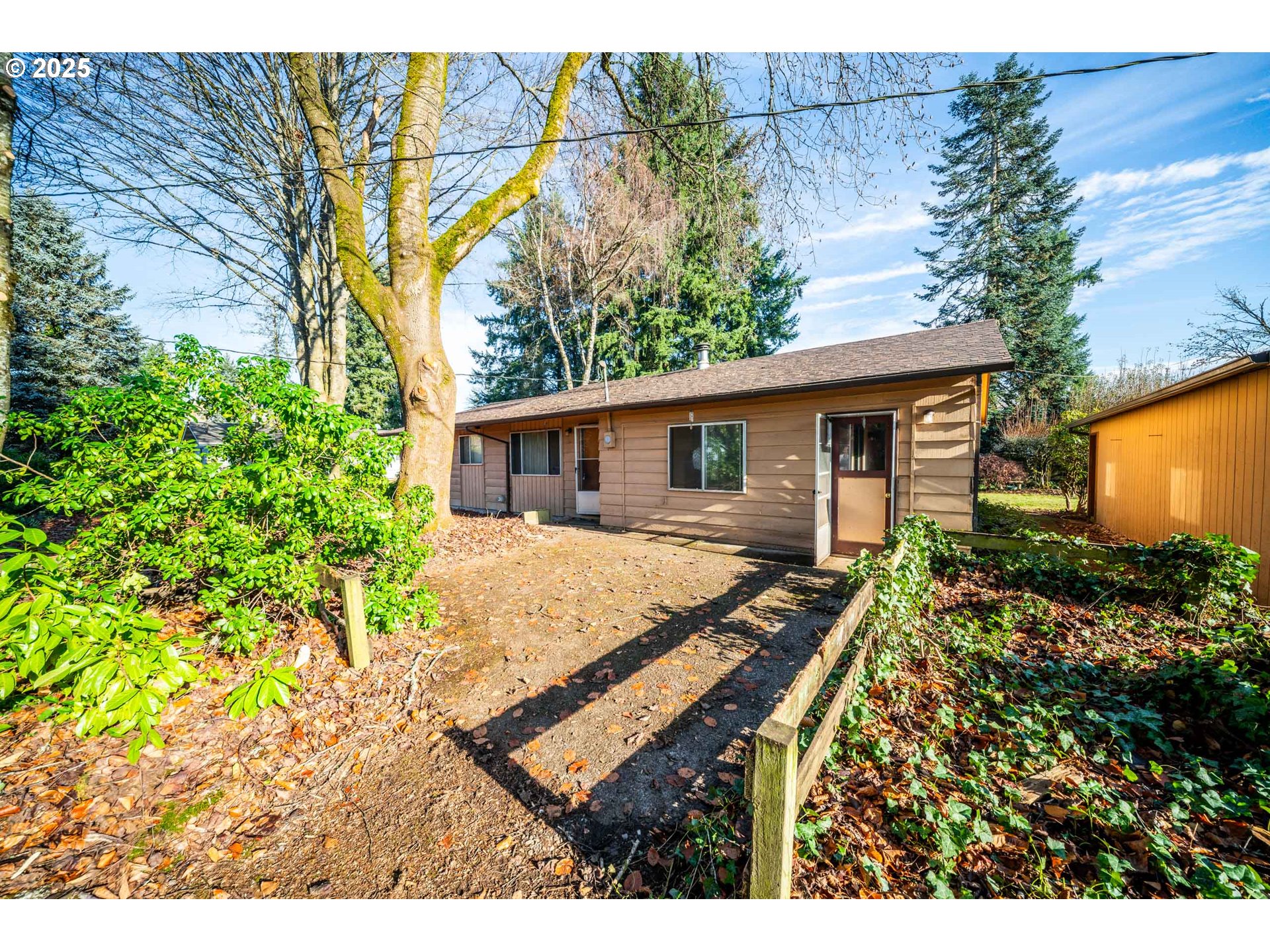 1109 Southeast 2nd Avenue Battle Ground, WA 98604 - Photo 2 of 30 a view of a house with backyard and trees