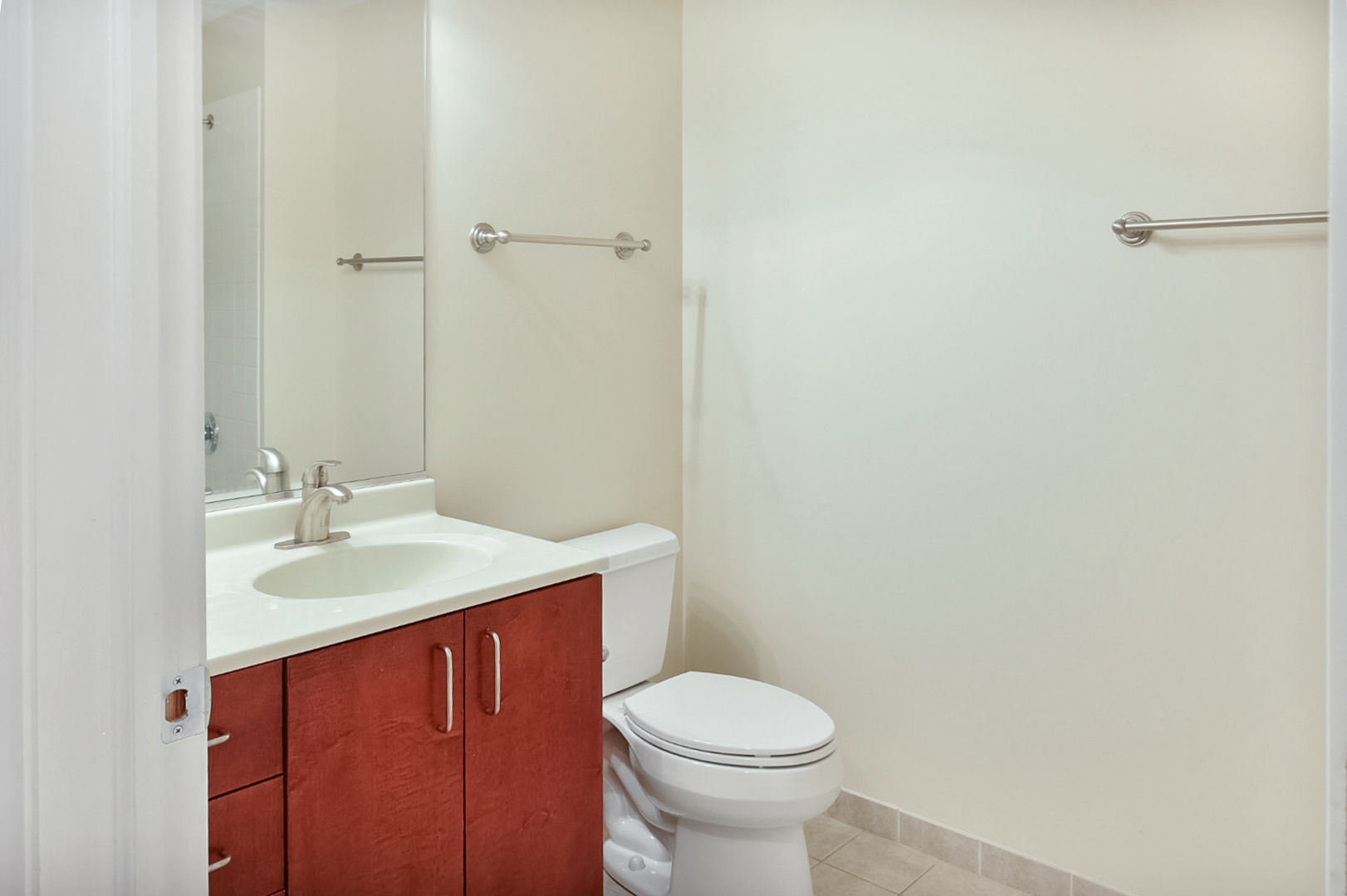 135 South York Street, Unit 314 Elmhurst, IL 60126 - Photo 11 of 24 a bathroom with a sink and a toilet