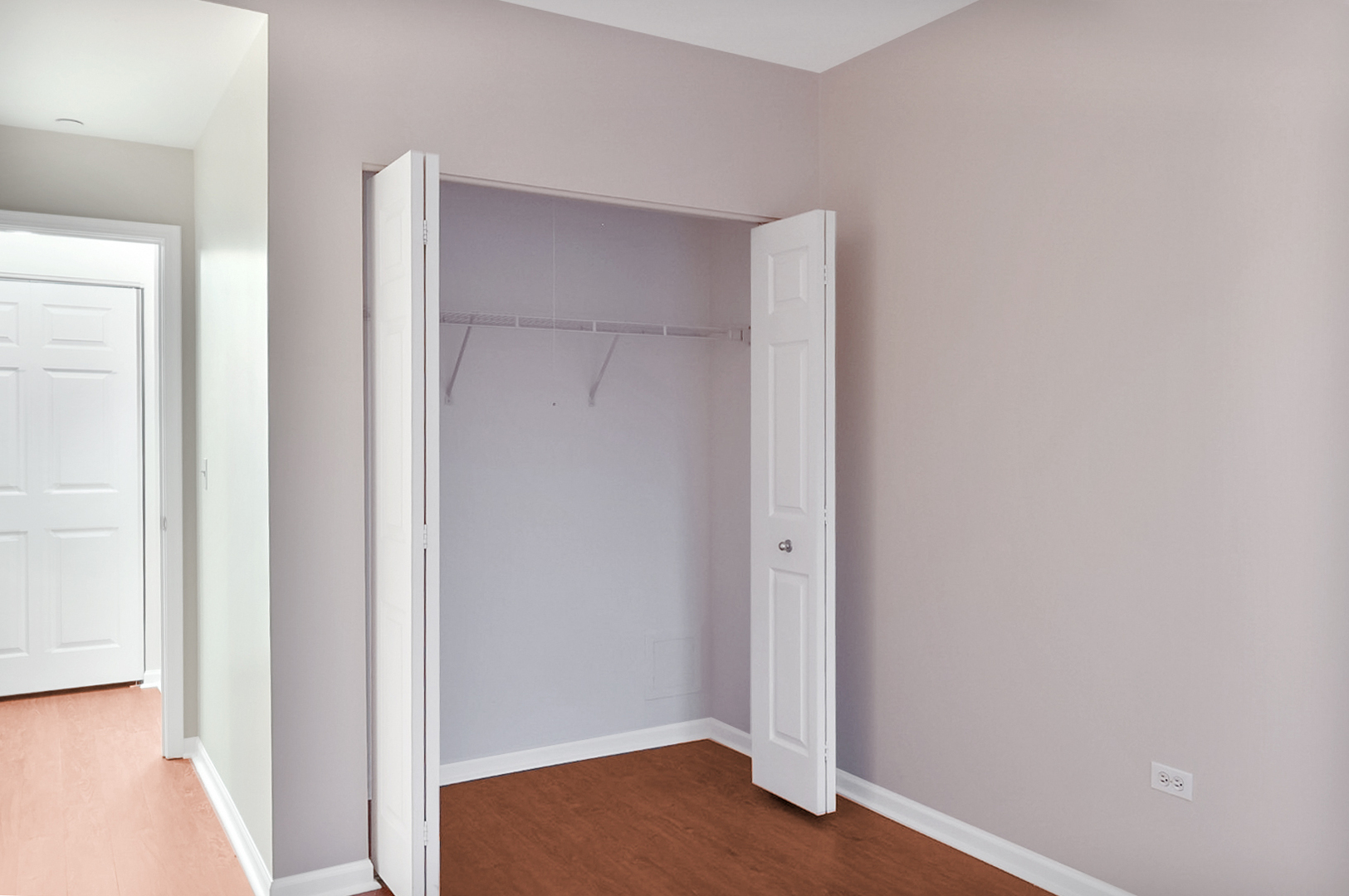 135 South York Street, Unit 314 Elmhurst, IL 60126 - Photo 13 of 24 a view of room with closet and wooden floor